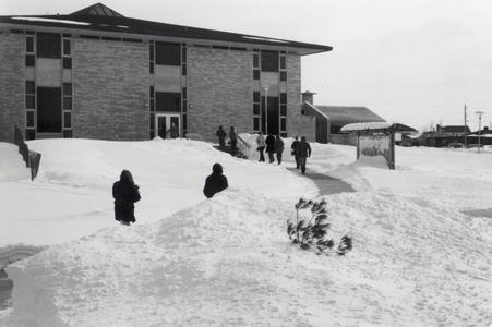 Students walking in the snow, University of Wisconsin--Marshfield/Wood County, 1975
