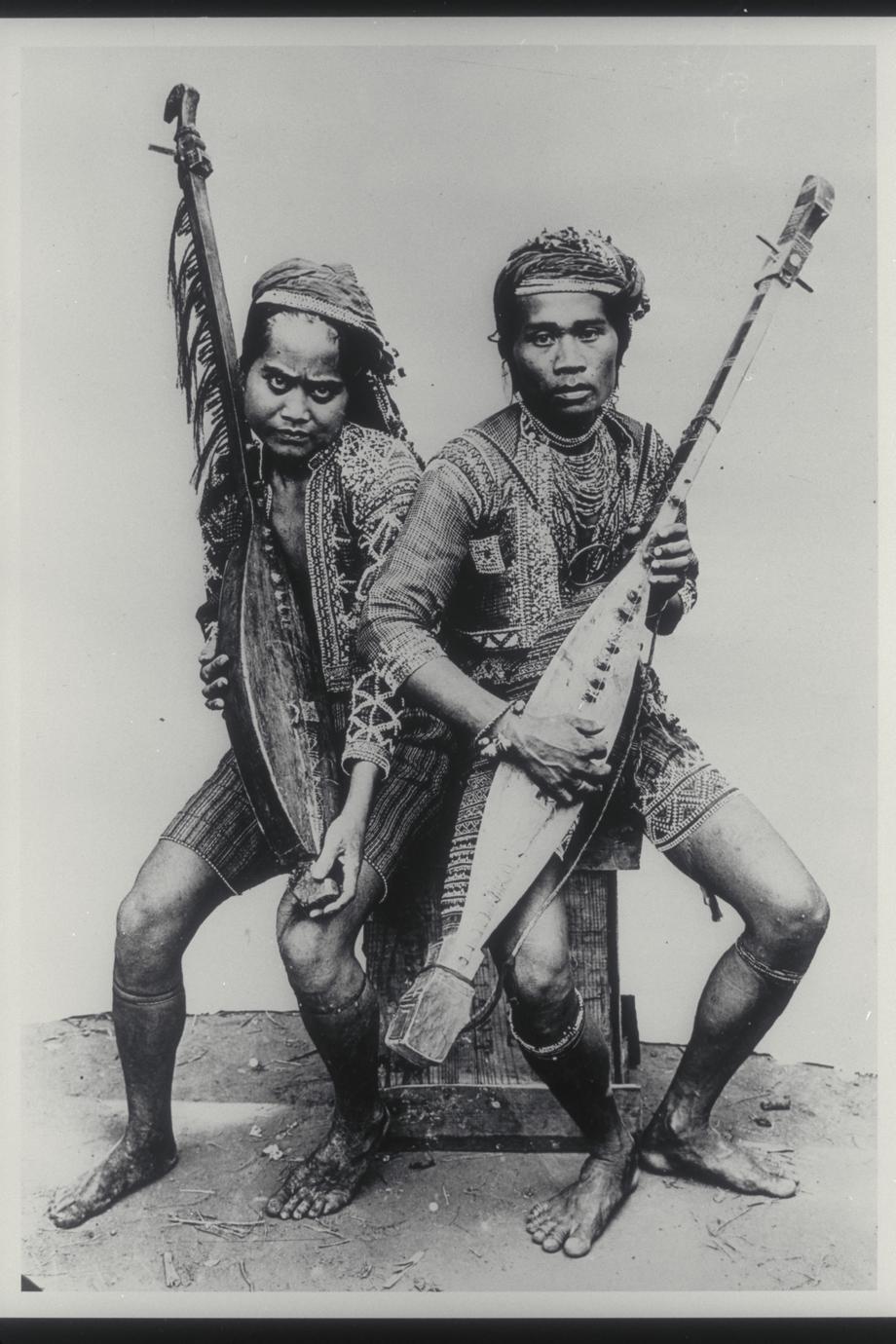 Two musicians in traditional clothing, ca. 1920-1930