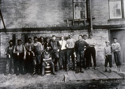 Brewery workers with beer glasses