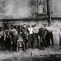 Brewery workers with beer glasses