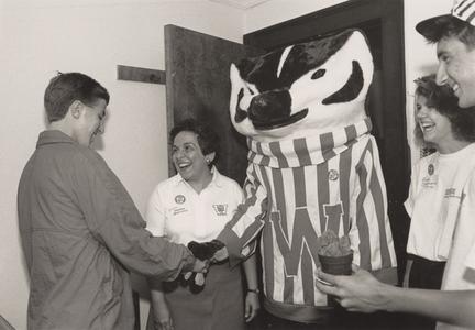 Donna Shalala with Bucky Badger and students
