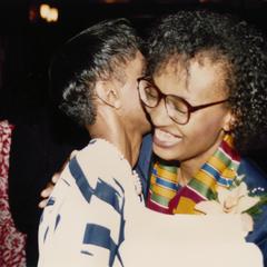 Students hugging at Multicultural Reception and Awards ceremony in 1990