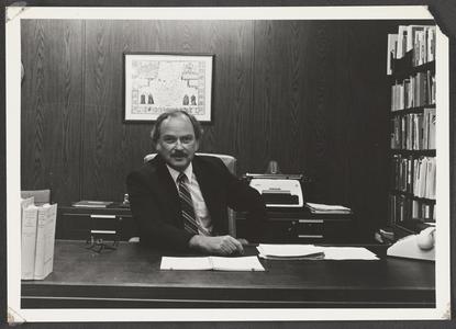 Dean Robert Thompson at his desk