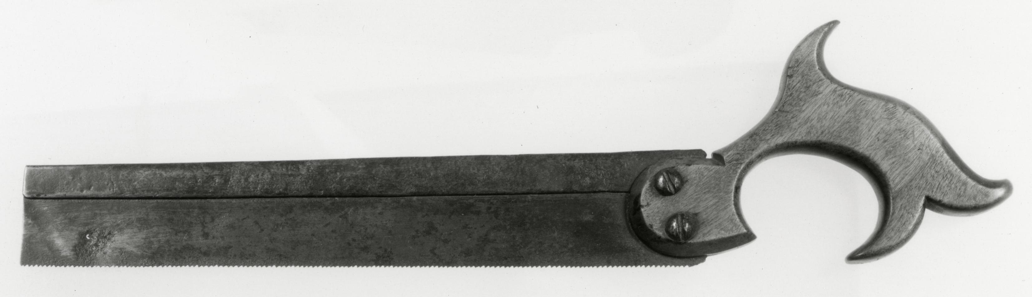 Black and white photograph of a dovetail saw.