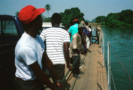People Hand-pulling the Ferry Across the Gambia River at Bansang