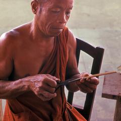 Monk artisan inside Wat Pa Phay