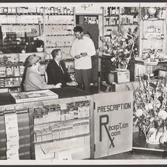 Customers wait for their prescriptions to be filled