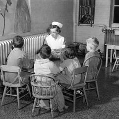 Nursing Student Reading to Children