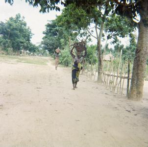 Women Walking on the Main Road from Mbe to the River