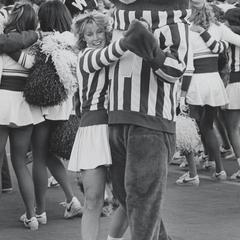 UW cheerleader dances with Bucky Badger