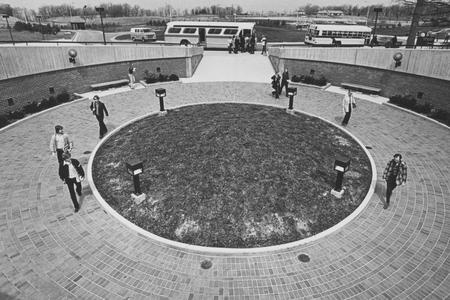 Students entering the campus via the circle entrance of the Library Learning Center