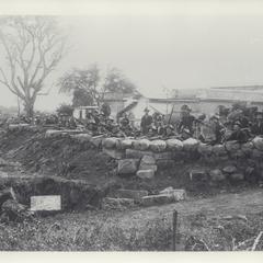 Company of American soldiers dug into defensive position at the Antohan pumping station, 1899