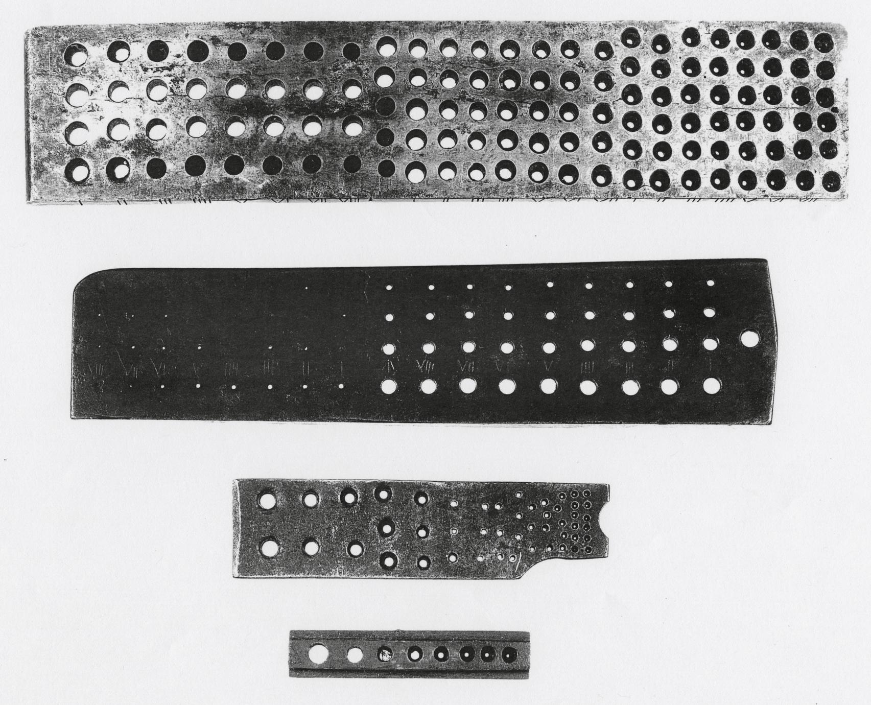 Black and white photograph of wire plates or drawplates.