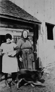 Helen Wautlet and Grandma Martin gathering eggs