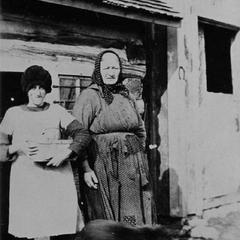 Helen Wautlet and Grandma Martin gathering eggs