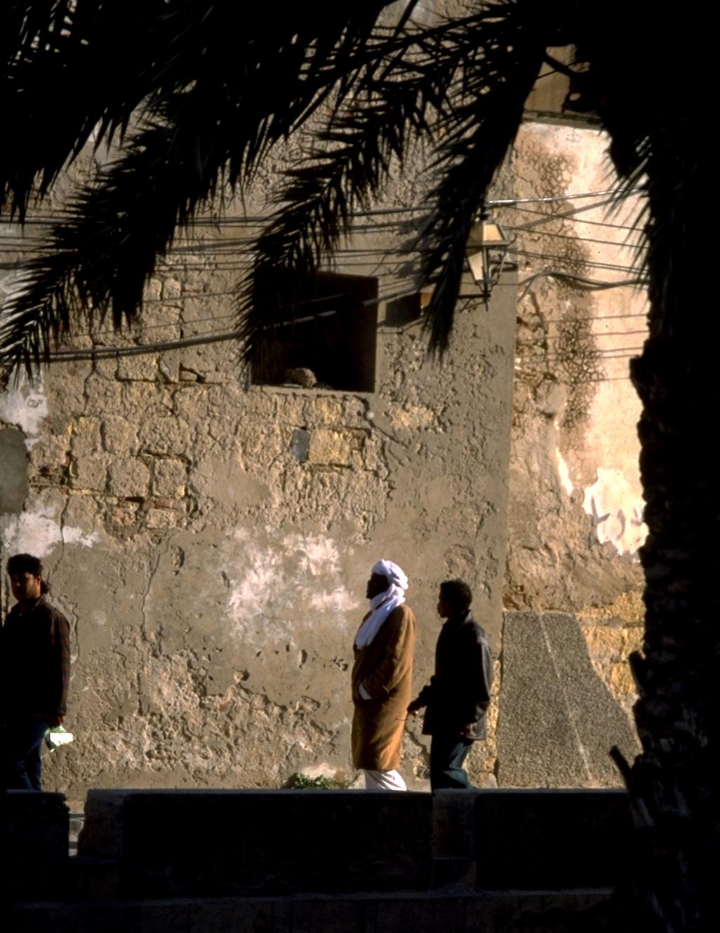 Passers-by Viewed Through Marcus Aurelius Arch in Tripoli Medina