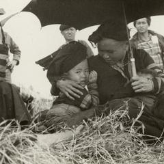 Striped Hmong woman and children