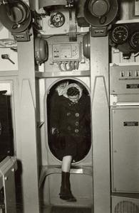 U.S.S. Mero : woman stepping through hatch