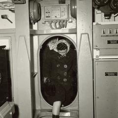 U.S.S. Mero  : woman stepping through hatch