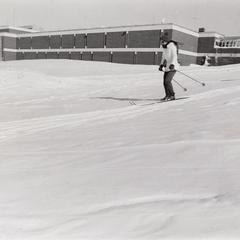 Student skiing on campus
