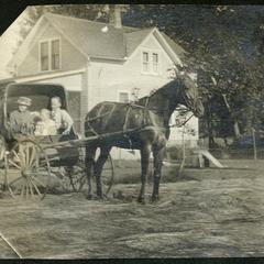 Lorine in horse-drawn buggy