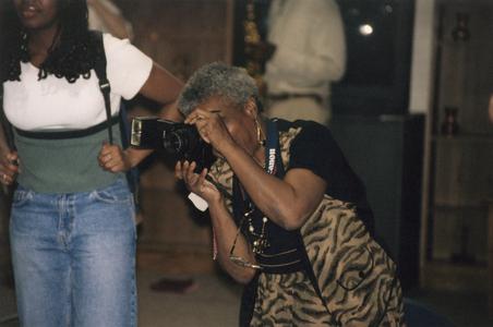 Taking pictures at 1999 Multicultural Graduation Reception