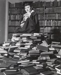 Marcia Windness with stack of books