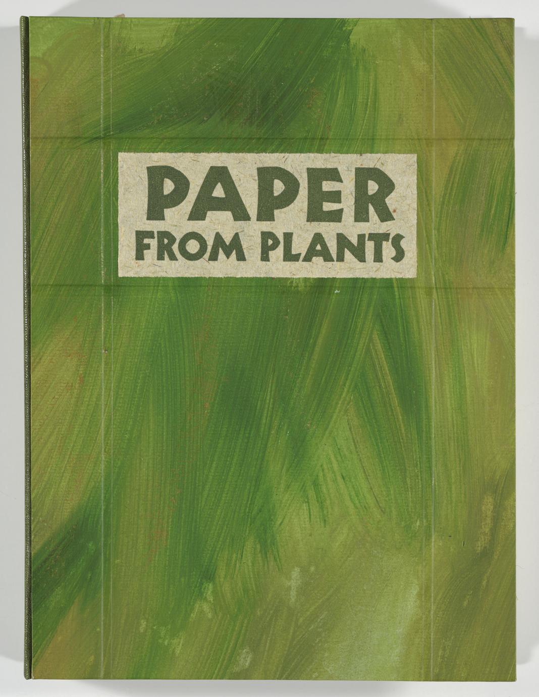 A green book cover with visible brushstrokes of different shades of green, mimicking plant leaves. There is a white rectangle on the upper center of the cover where the title, "paper from plants," is written.