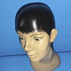 Plaster head with painted black pixie hair