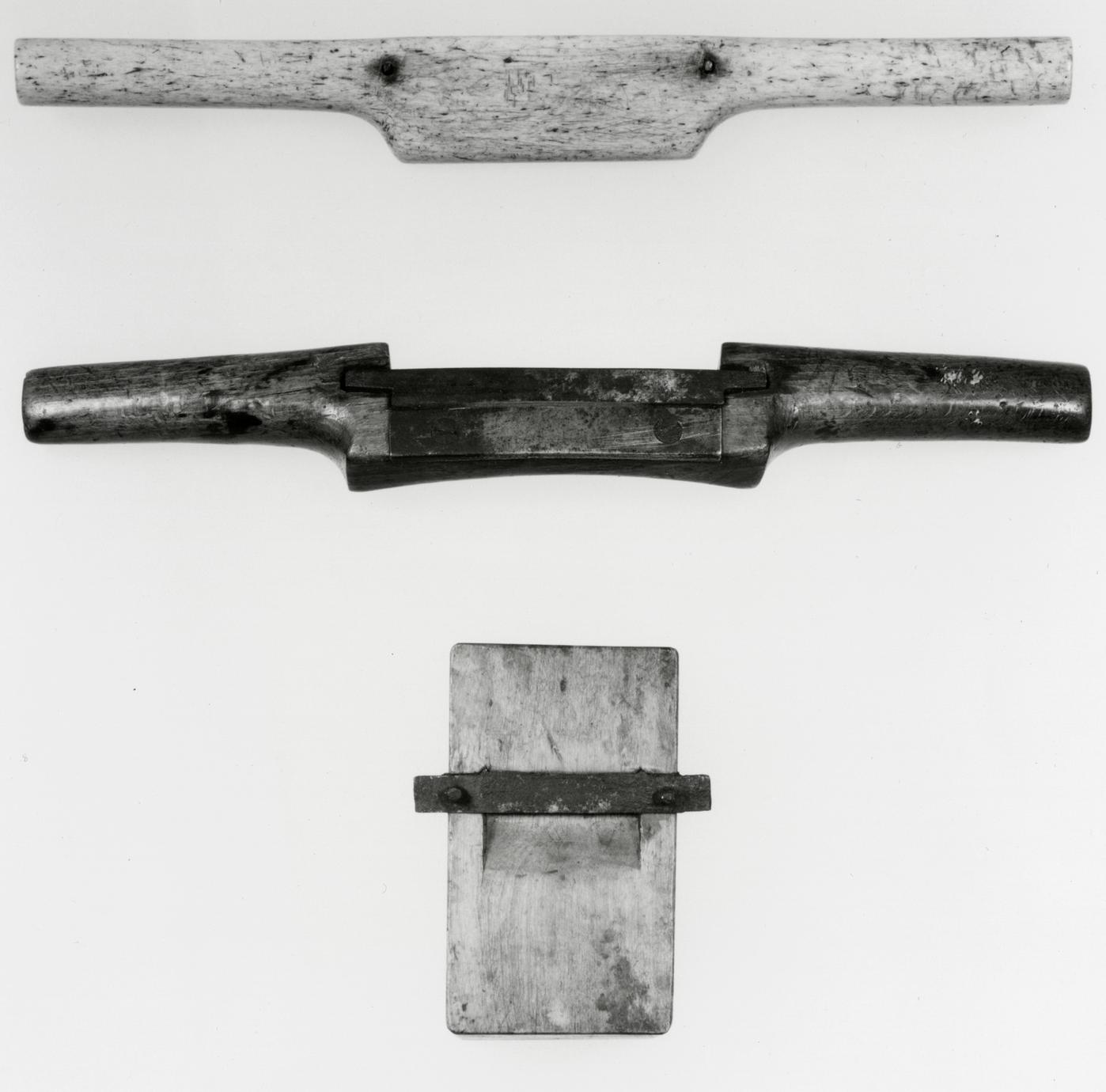 Black and white photograph of various spokeshaves.