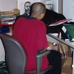 Male student working at desk