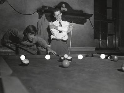 Students playing pool at open house