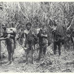 Hunters with spears, ropes and dead wild pigs, Mountain Province, ca. 1920-1930