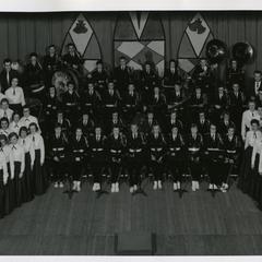 Stout Band with Stout Symphonic Singers, Christmas concert group photograph on stage, December 1957