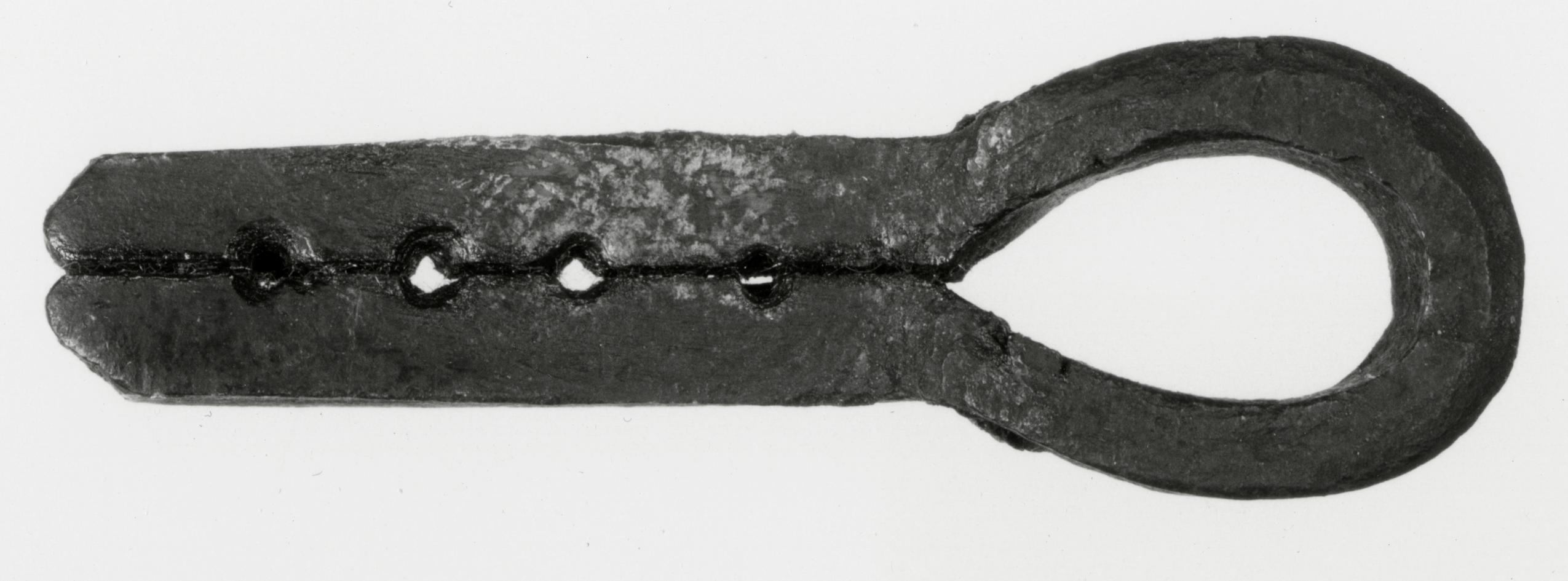 Black and white photograph of a nail and rivet header.