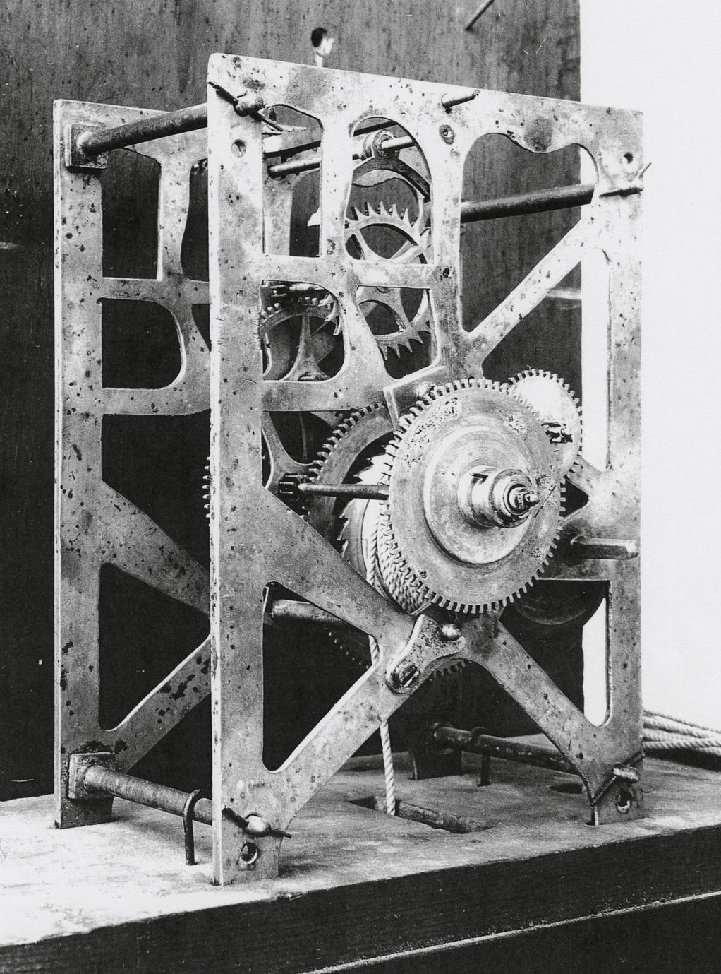 Black and white photograph of a silent clock gear system.