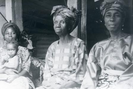 Three women selling kola