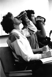Students drinking beer in class