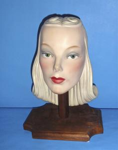 Ceramic head with long, tightly curled blond hair