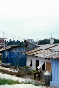 Shantytown with Downtown High Rise Buildings in Background