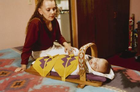 Stephanie Barea with her son, Aaron Barea, in a cradleboard