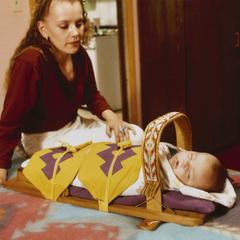 Stephanie Barea with her son, Aaron Barea, in a cradleboard