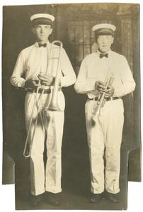 Two men with brass instruments