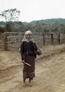 A Nyaheun woman walks to her fields in Attapu Province
