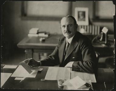 Charles W. Nash at his desk