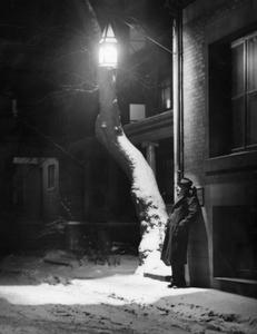 Man standing in lamp light