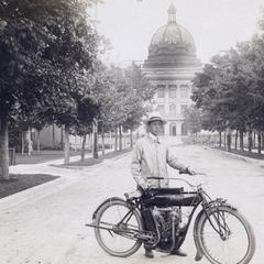 Oneida Co. agent E.L. Luther with motorcycle