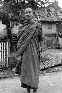 Monk with his alms bowl in carrying sack