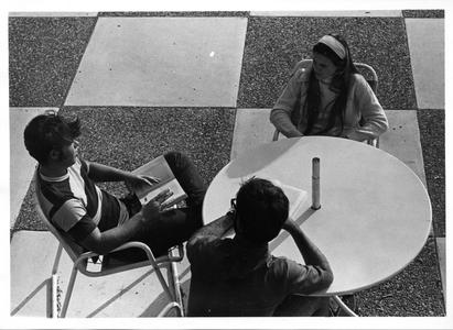 Students socializing on the patio