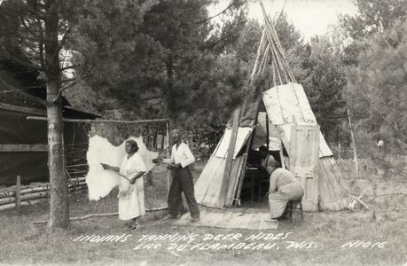 Ojibwa Indians tanning deer hides